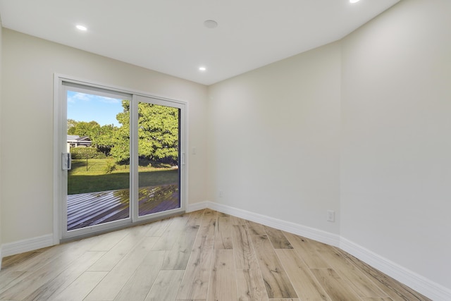 unfurnished room featuring baseboards, recessed lighting, and light wood finished floors