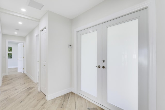 interior space with light wood finished floors, visible vents, baseboards, and recessed lighting