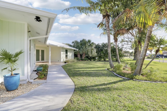 view of yard featuring french doors
