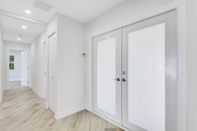 interior space with light wood-style floors, recessed lighting, visible vents, and baseboards