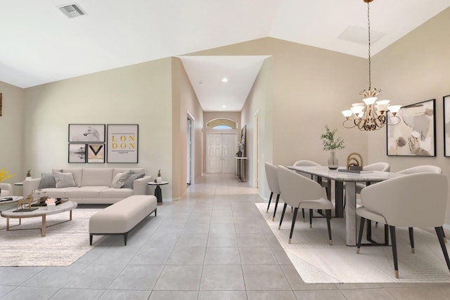 8430 Marsala Way, Boynton Beach, FL 33472 - living area with light tile patterned floors, a chandelier, and vaulted ceiling