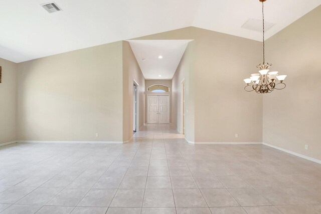 8430 Marsala Way, Boynton Beach, FL 33472 - empty room featuring light tile patterned floors, a chandelier, baseboards, and high vaulted ceiling