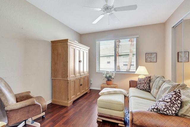 living area with dark hardwood / wood-style flooring and ceiling fan