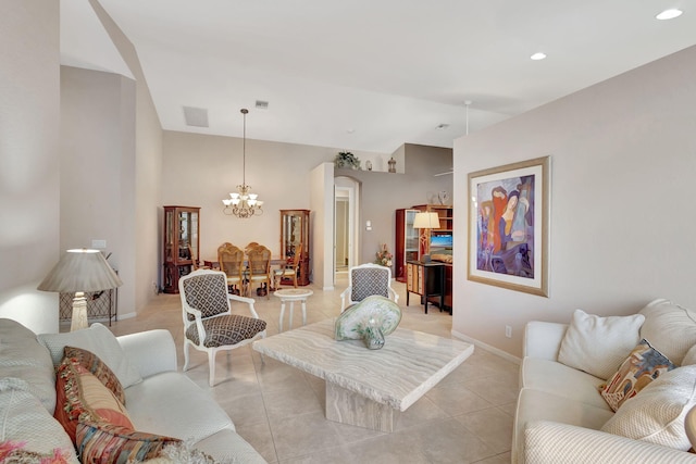 living room with light tile patterned floors and a notable chandelier