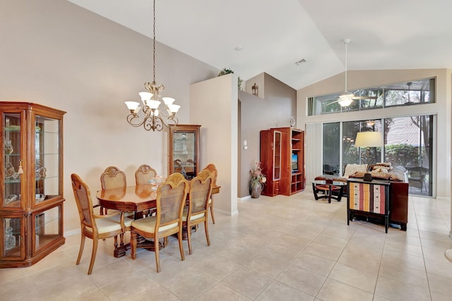 tiled dining room with a chandelier and high vaulted ceiling