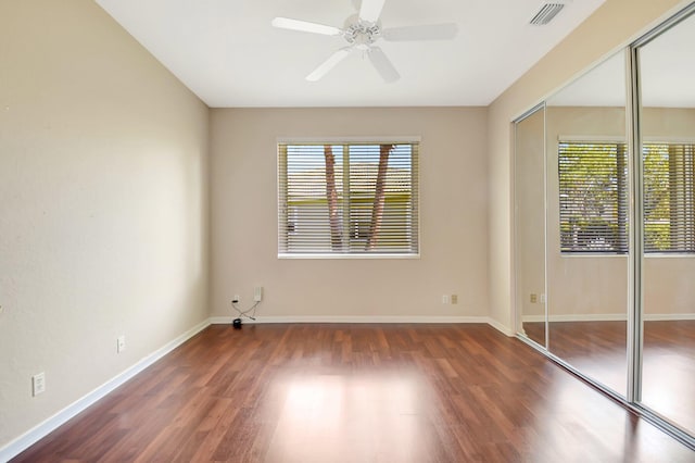 8430 Marsala Way, Boynton Beach, FL 33472 - unfurnished bedroom featuring wood finished floors, a closet, baseboards, and a ceiling fan