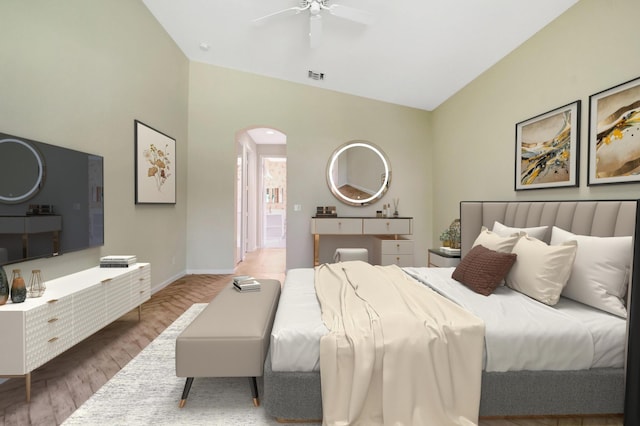 8430 Marsala Way, Boynton Beach, FL 33472 - bedroom with arched walkways, wood finished floors, baseboards, lofted ceiling, and a ceiling fan