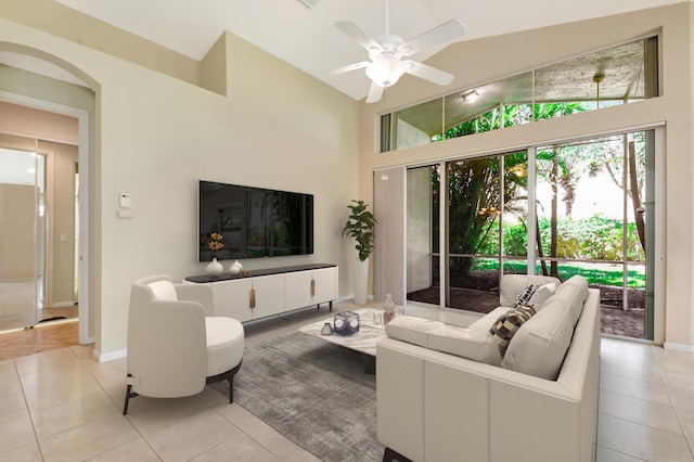 8430 Marsala Way, Boynton Beach, FL 33472 - living room with light tile patterned floors, high vaulted ceiling, ceiling fan, baseboards, and arched walkways