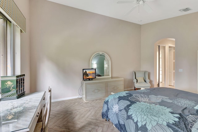 bedroom with ceiling fan and light parquet flooring