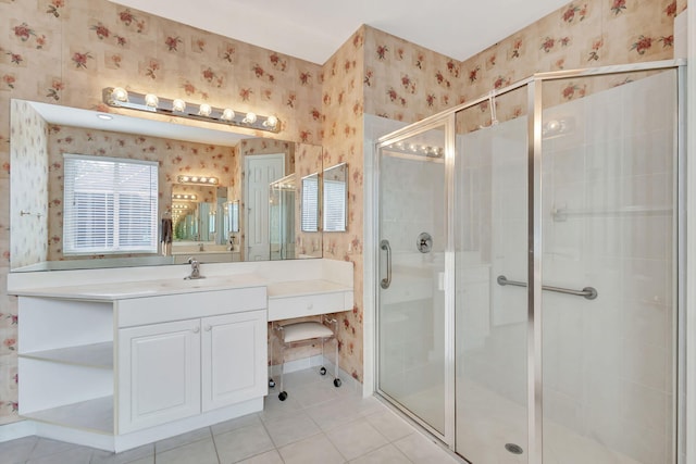 bathroom featuring vanity, an enclosed shower, and tile patterned flooring