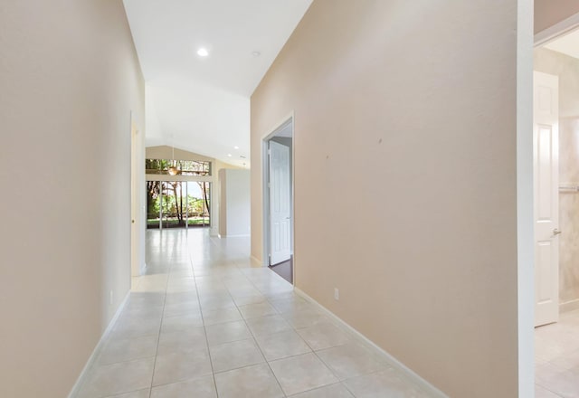 8430 Marsala Way, Boynton Beach, FL 33472 - hall featuring vaulted ceiling, light tile patterned flooring, and baseboards