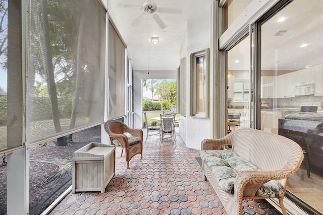 sunroom / solarium with ceiling fan