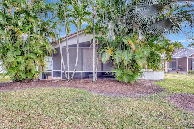 view of yard featuring a lanai