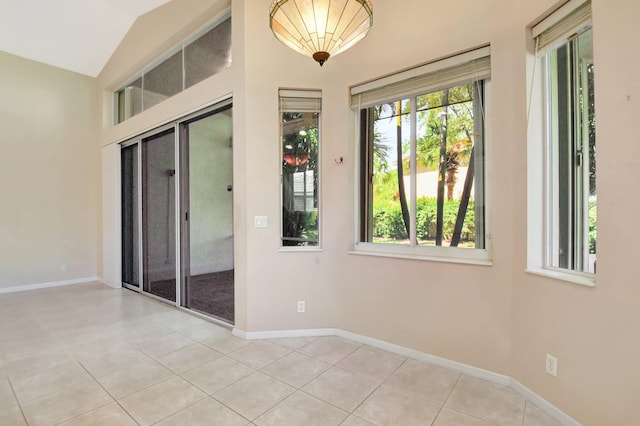 8430 Marsala Way, Boynton Beach, FL 33472 - unfurnished room with tile patterned flooring, baseboards, and lofted ceiling