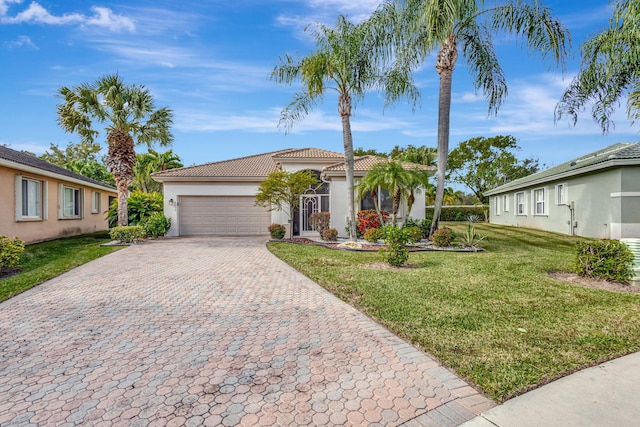 8430 Marsala Way, Boynton Beach, FL 33472 - view of front facade with decorative driveway, a tiled roof, a garage, a front yard, and stucco siding