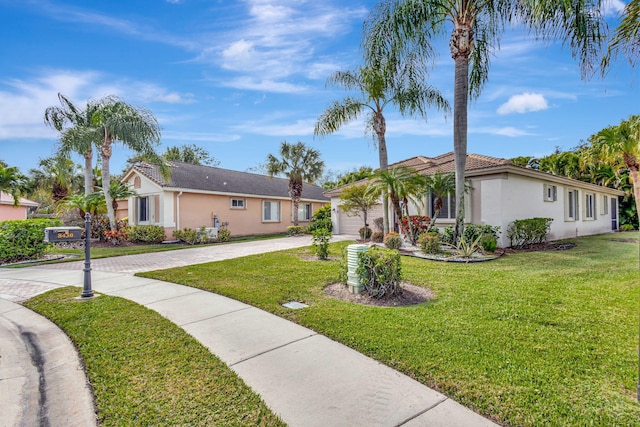 8430 Marsala Way, Boynton Beach, FL 33472 - ranch-style house featuring stucco siding, driveway, a garage, and a front lawn