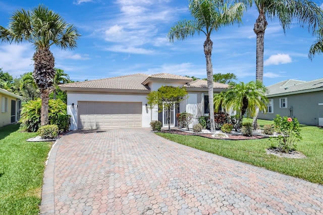 8430 Marsala Way, Boynton Beach, FL 33472 - view of front of house featuring stucco siding, a tile roof, a garage, decorative driveway, and a front yard