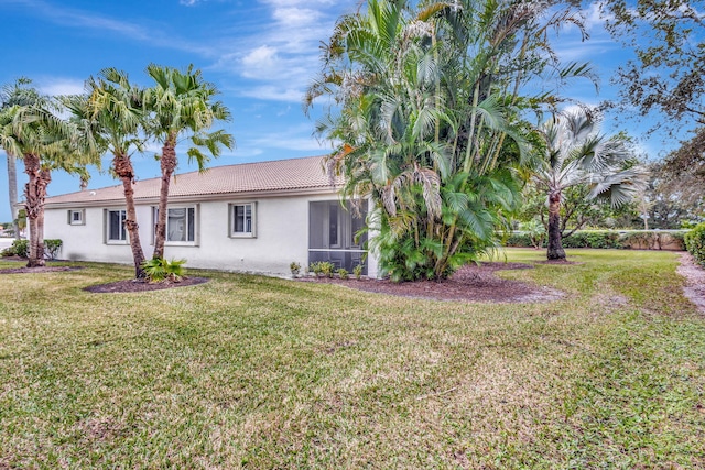 8430 Marsala Way, Boynton Beach, FL 33472 - back of property featuring stucco siding, a yard, and a tile roof
