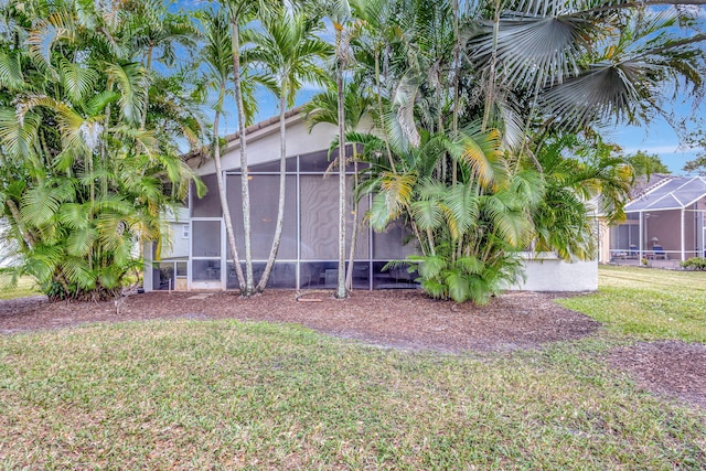 8430 Marsala Way, Boynton Beach, FL 33472 - view of green lawn with a sunroom