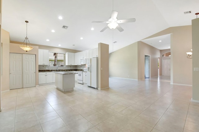 8430 Marsala Way, Boynton Beach, FL 33472 - kitchen with white appliances, open floor plan, vaulted ceiling, ceiling fan, and decorative backsplash
