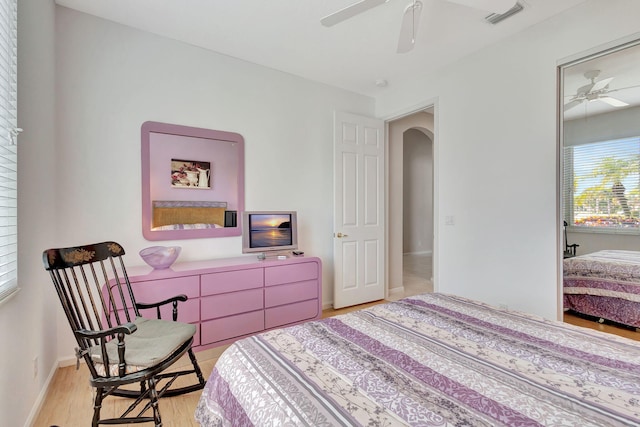 bedroom with ceiling fan and light hardwood / wood-style floors