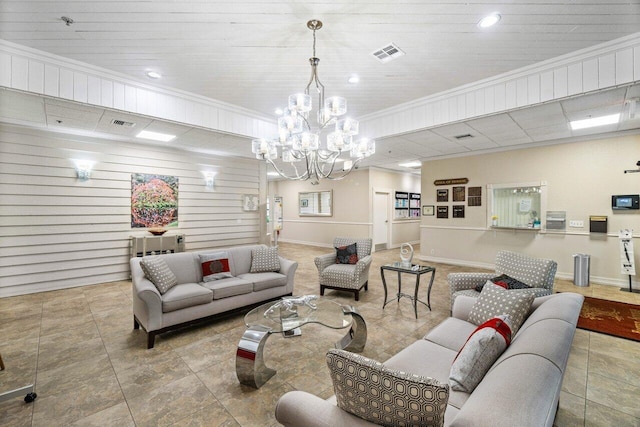 living room featuring a notable chandelier and crown molding