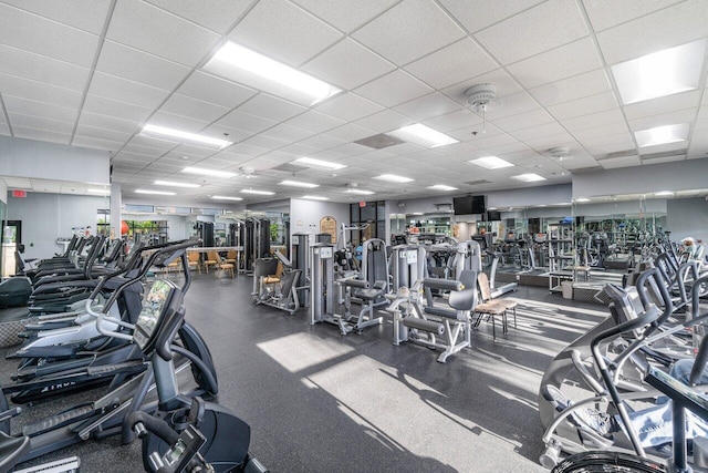 exercise room with a drop ceiling