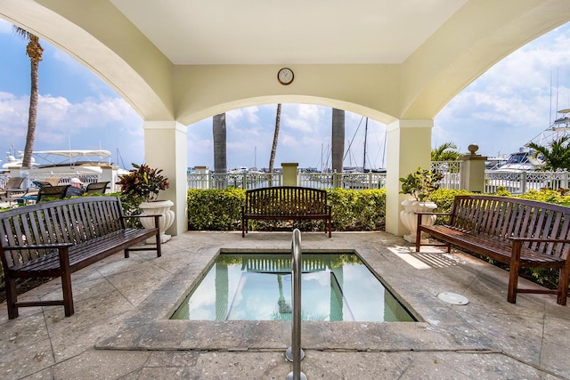 view of pool with a patio, an outdoor hangout area, and an in ground hot tub