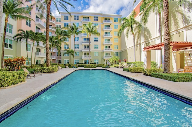 view of swimming pool with a pergola