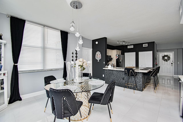 view of tiled dining space