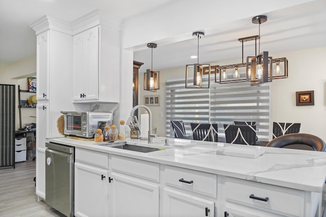 kitchen featuring pendant lighting, dishwasher, sink, white cabinets, and kitchen peninsula