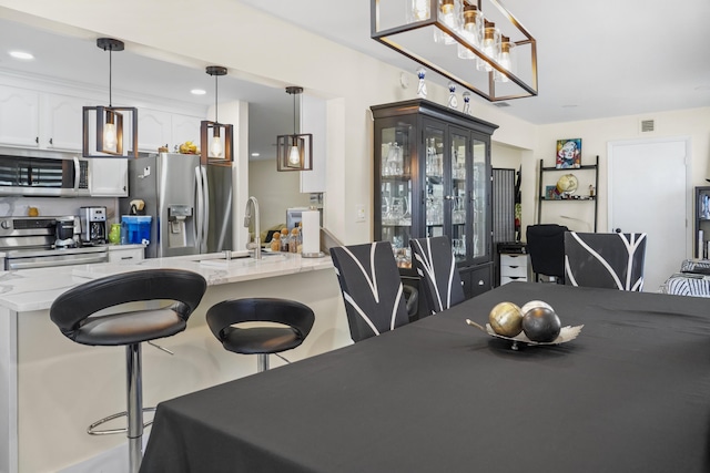 dining room with sink and french doors