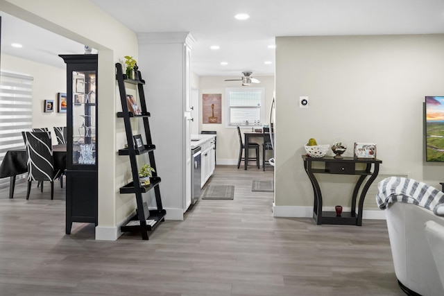 hallway with light hardwood / wood-style floors