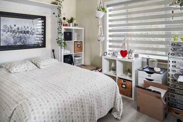 bedroom with wood-type flooring