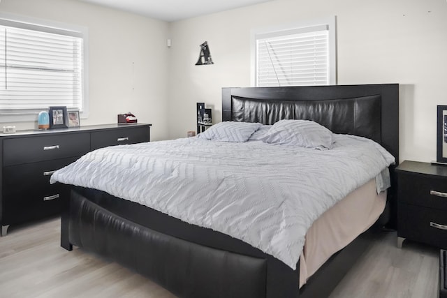 bedroom with light hardwood / wood-style floors