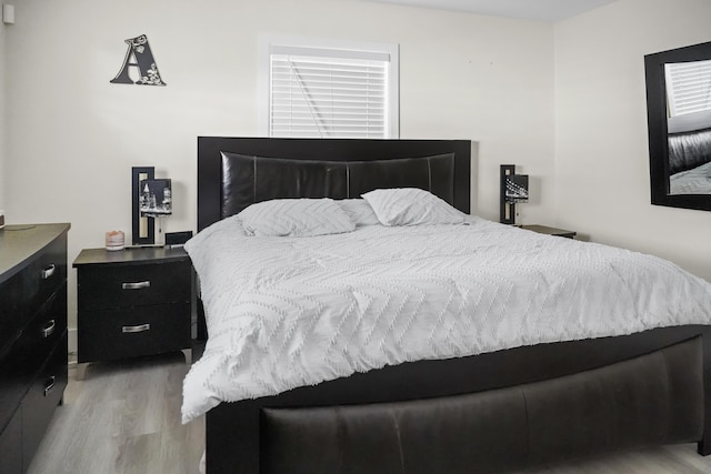 bedroom with light hardwood / wood-style flooring