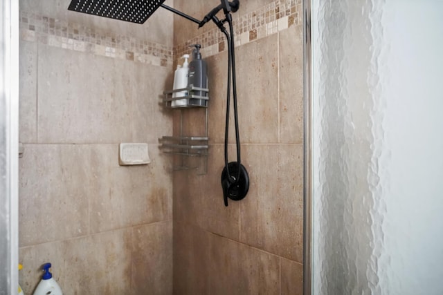 bathroom with a tile shower