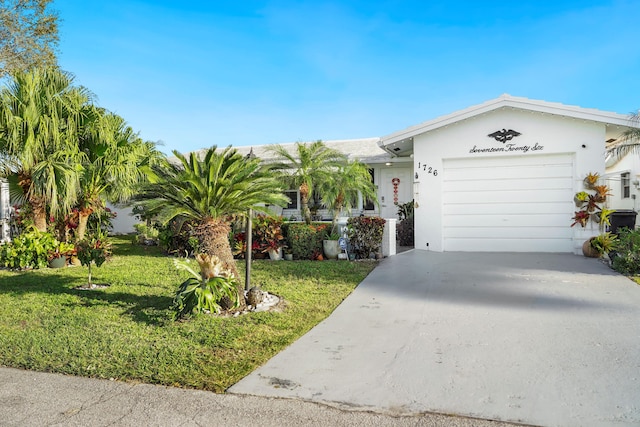 single story home with a garage and a front yard