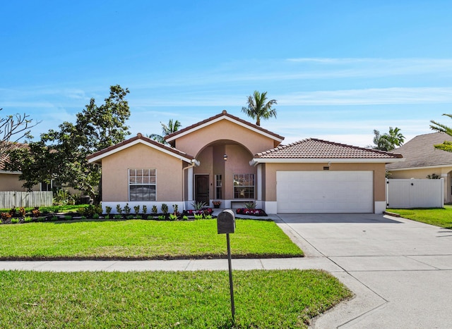 view of front of house featuring a garage and a front yard