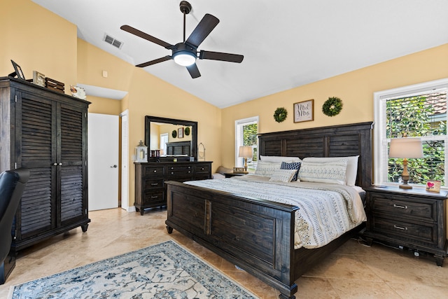 tiled bedroom with vaulted ceiling and ceiling fan