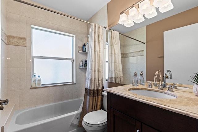 full bathroom featuring shower / tub combo with curtain, vanity, and toilet