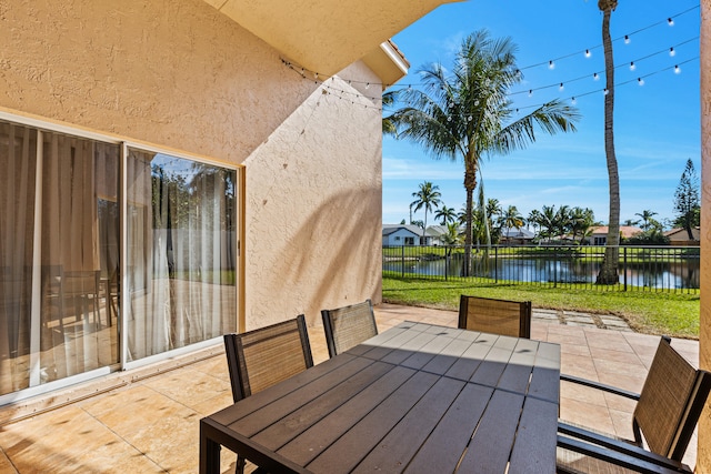 view of patio / terrace featuring a water view