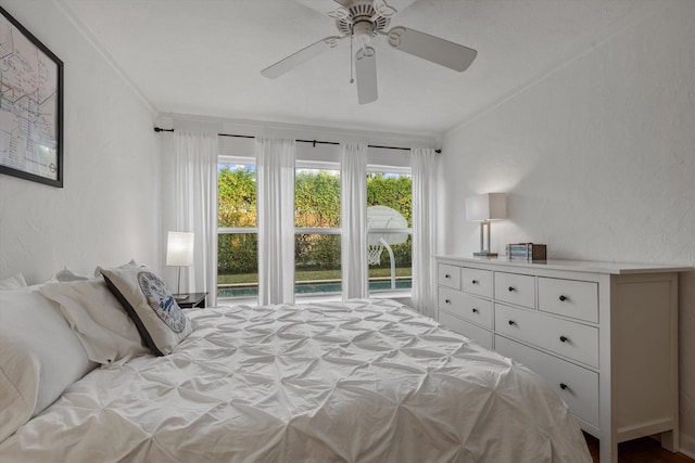 bedroom featuring crown molding and ceiling fan