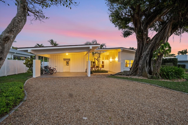 ranch-style home featuring a carport