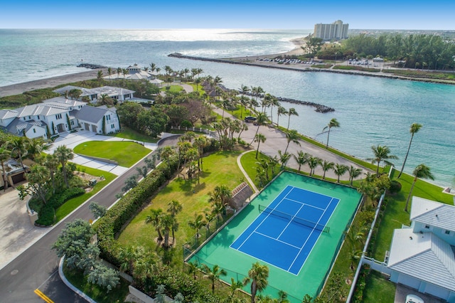 drone / aerial view featuring a water view and a view of the beach