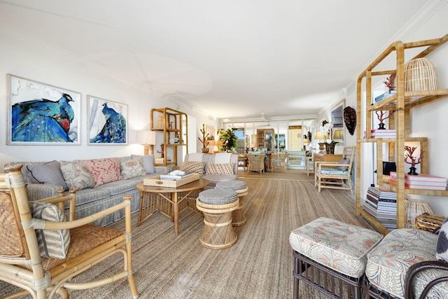 carpeted living room featuring ornamental molding