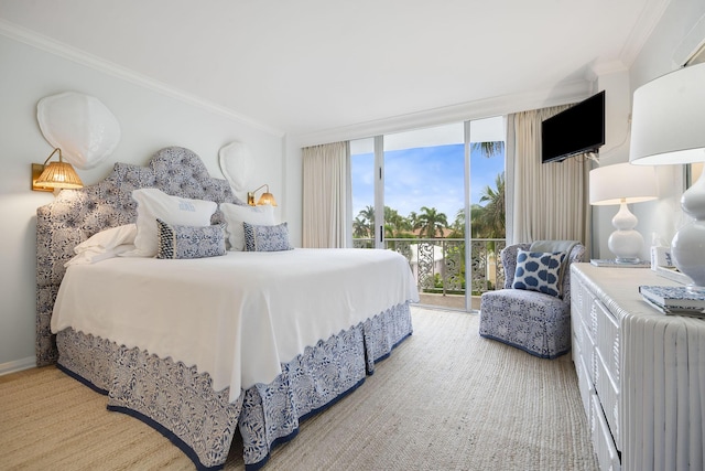 bedroom featuring a wall of windows, access to exterior, ornamental molding, and baseboards