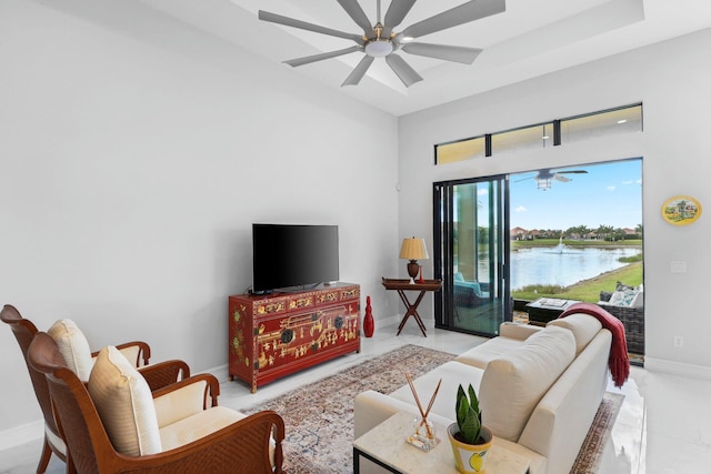 tiled living room featuring ceiling fan