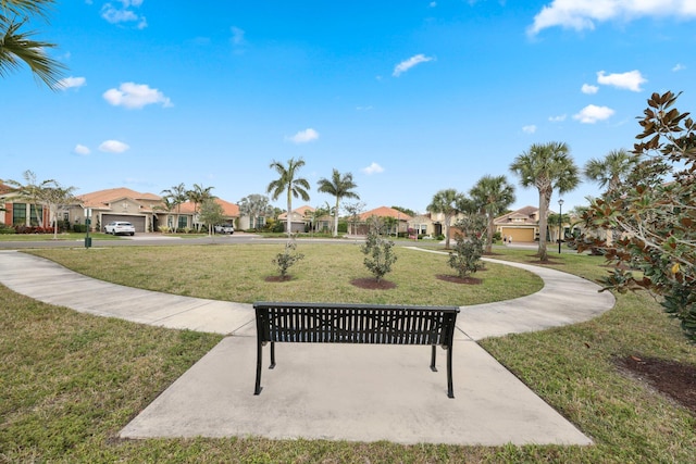 view of home's community with a lawn