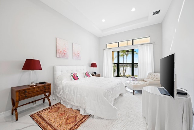 bedroom with a tray ceiling